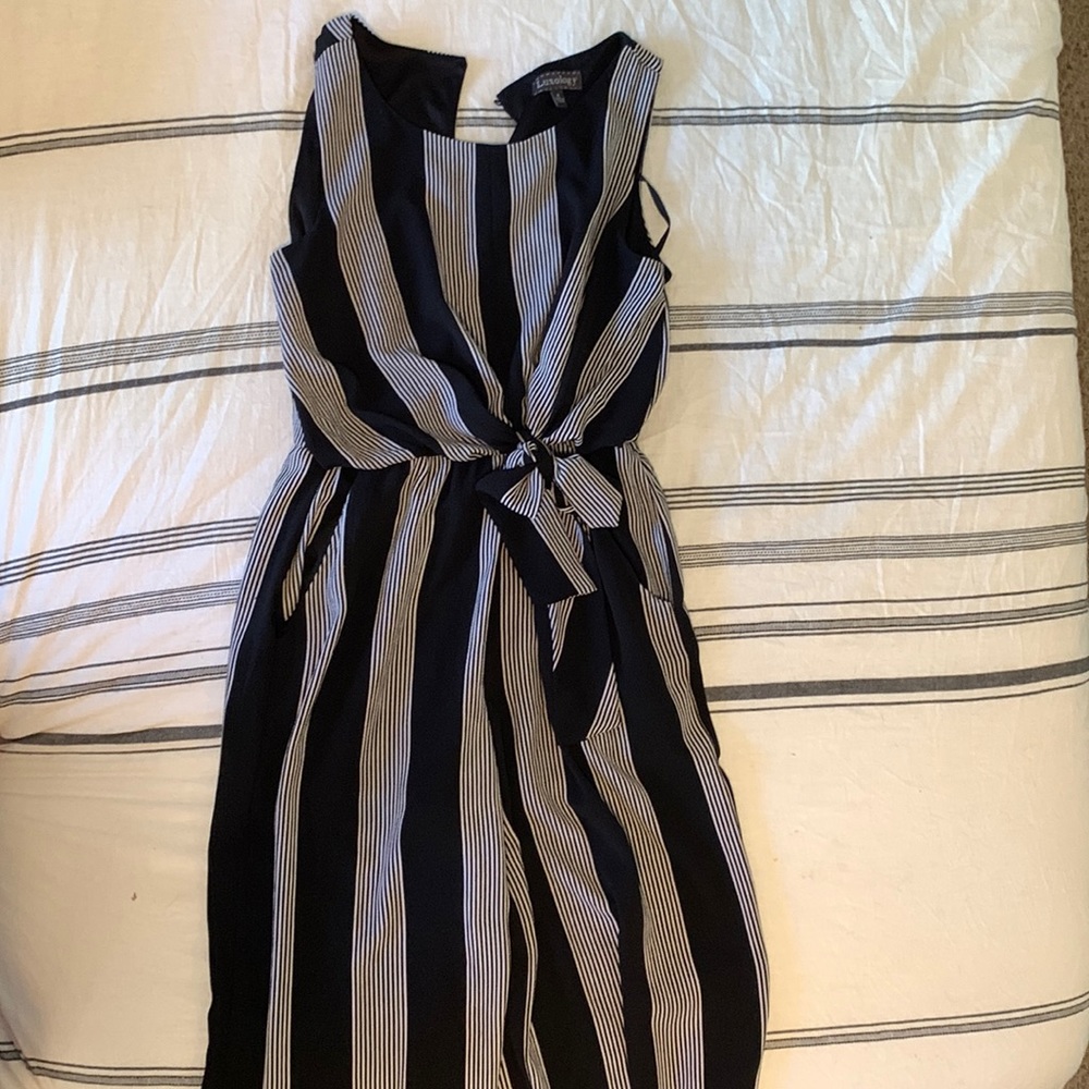 Black and white romper with accent belt. Size 4